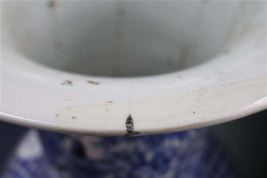 A massive Chinese blue and white vase and wood stand